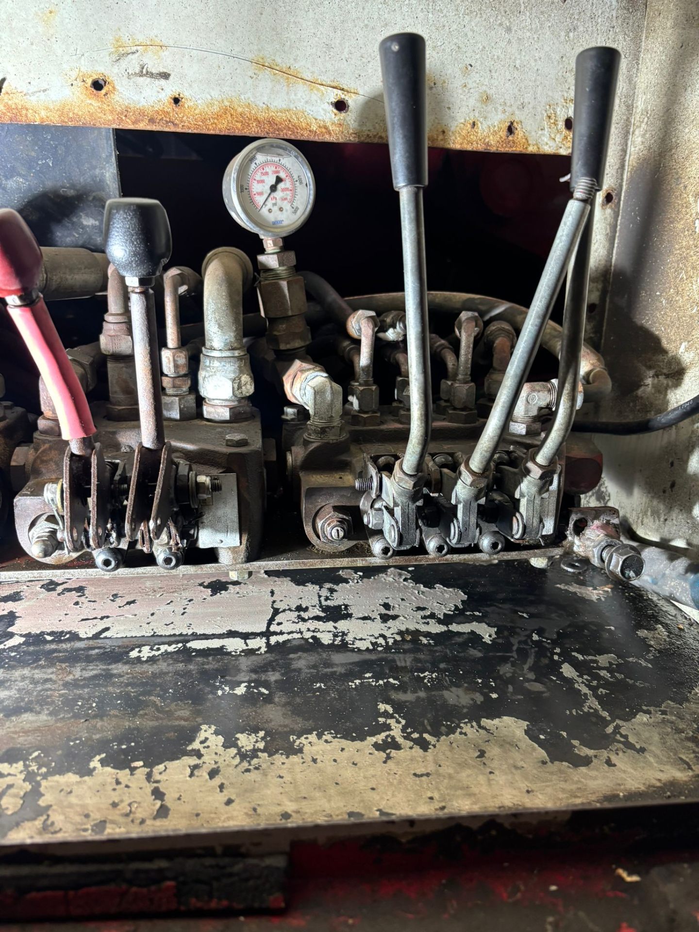 Valve bank with pressure gauge on heavy equipment